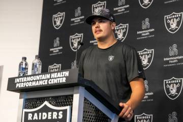 Raiders quarterback Aidan O’Connell listens to a question asked at a media availability ...