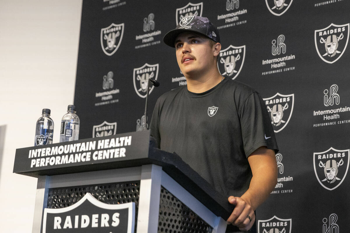 Raiders quarterback Aidan O’Connell listens to a question asked at a media availability ...