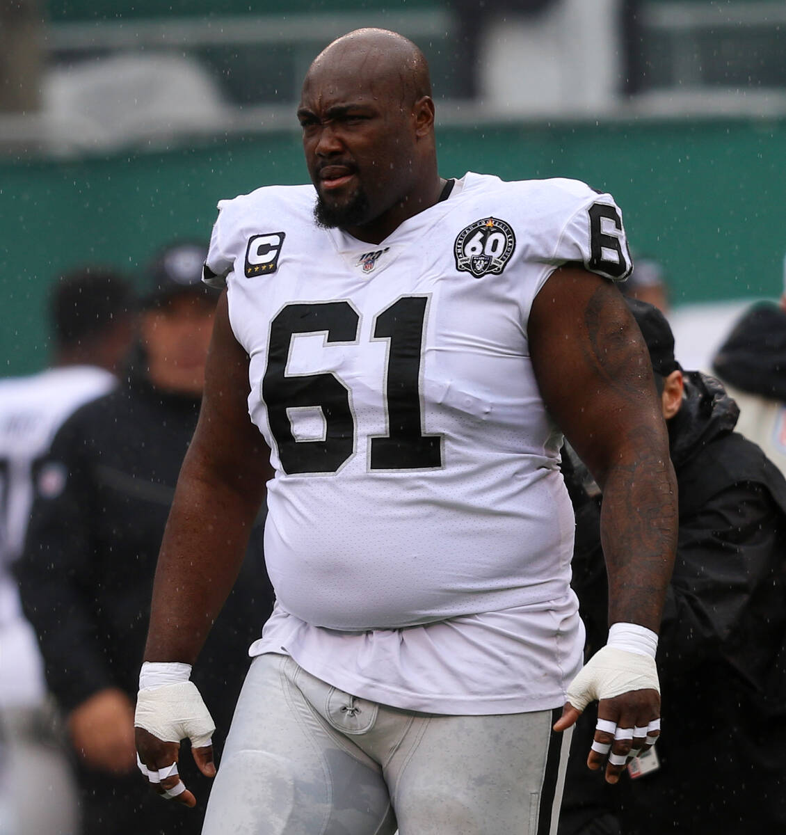 Oakland Raiders center Rodney Hudson (61) walks to the center of the field for a coin toss prio ...