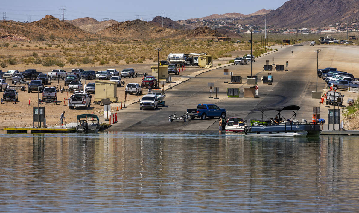 Boaters move about the Hemenway boat launch during a safe boating media event at the Lake Mead ...