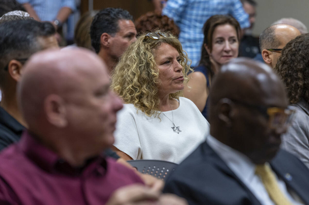 UNLV language instructor Marina Colacicchi listens after speaking during public comment at the ...