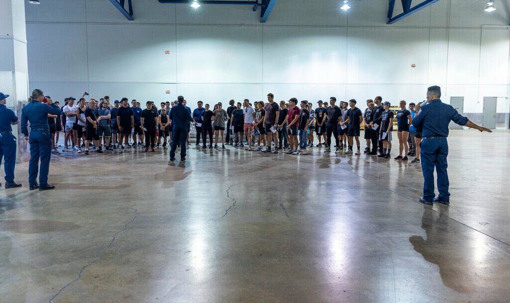 Participants receive instructions during the Las Vegas Fire & Rescue free community boot ca ...