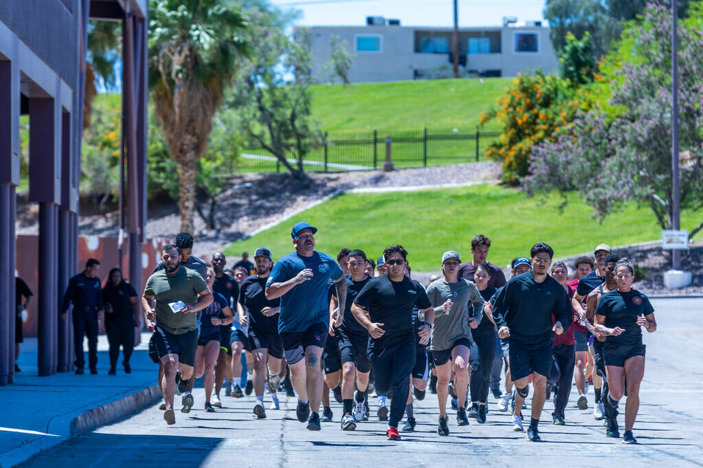 Participants complete a 1 1/2 mile run during the Las Vegas Fire & Rescue free community bo ...