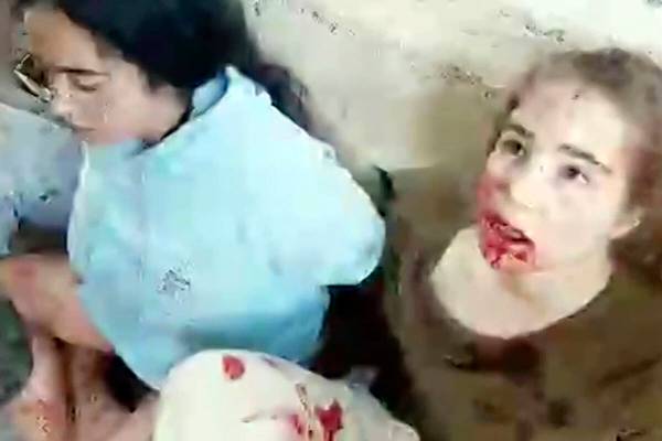 This image taken from video provided by the Hostage Families Forum, shows a bloodied Agam Berge ...