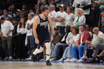 Dallas Mavericks guard Luka Doncic (77) celebrates a score against the Minnesota Timberwolves d ...