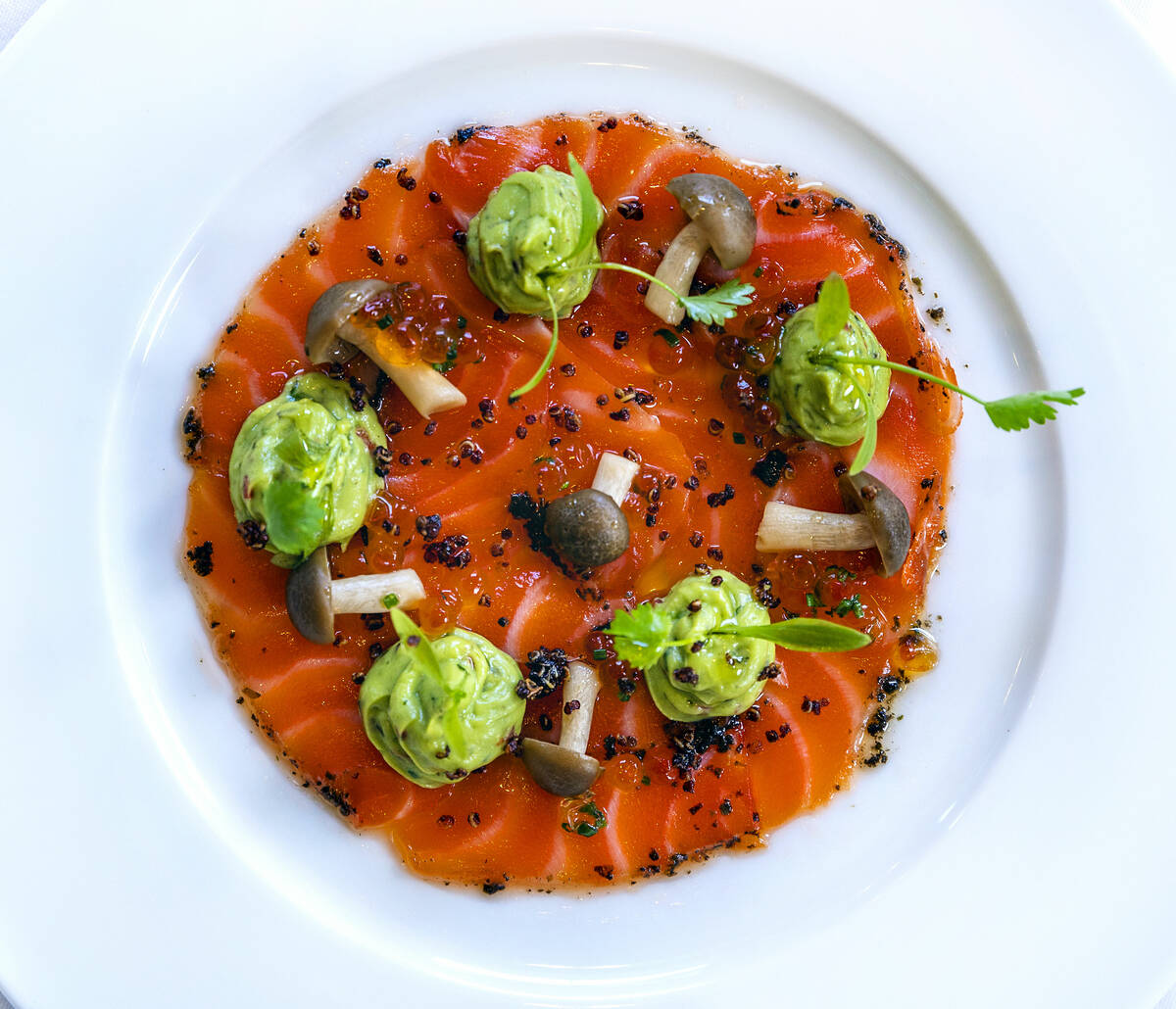 Salmon Carpaccio with tapenade crust, guacamole and Shimeji mushrooms during brunch at LPM with ...