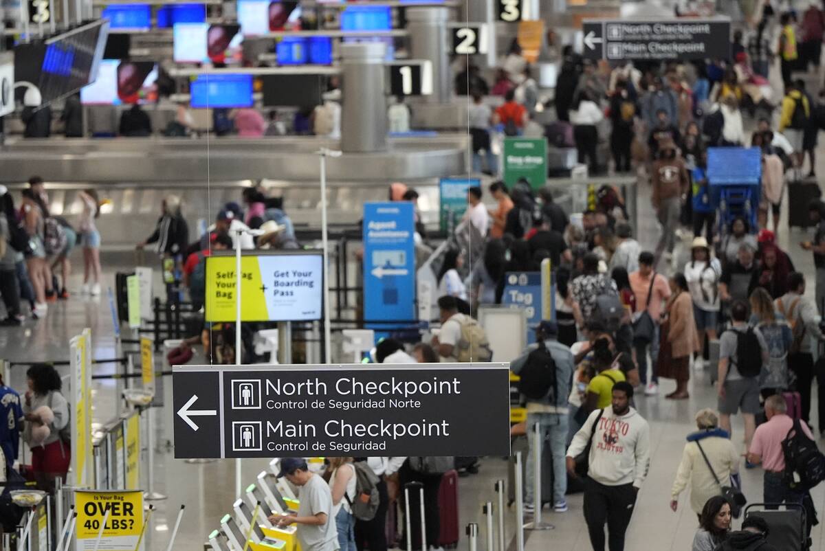Travelers move through Hartsfield-Jackson Atlanta International Airport ahead of Memorial Day, ...
