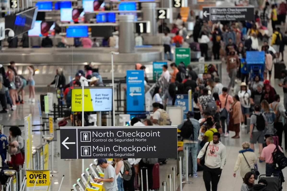 Travelers move through Hartsfield-Jackson Atlanta International Airport ahead of Memorial Day, ...