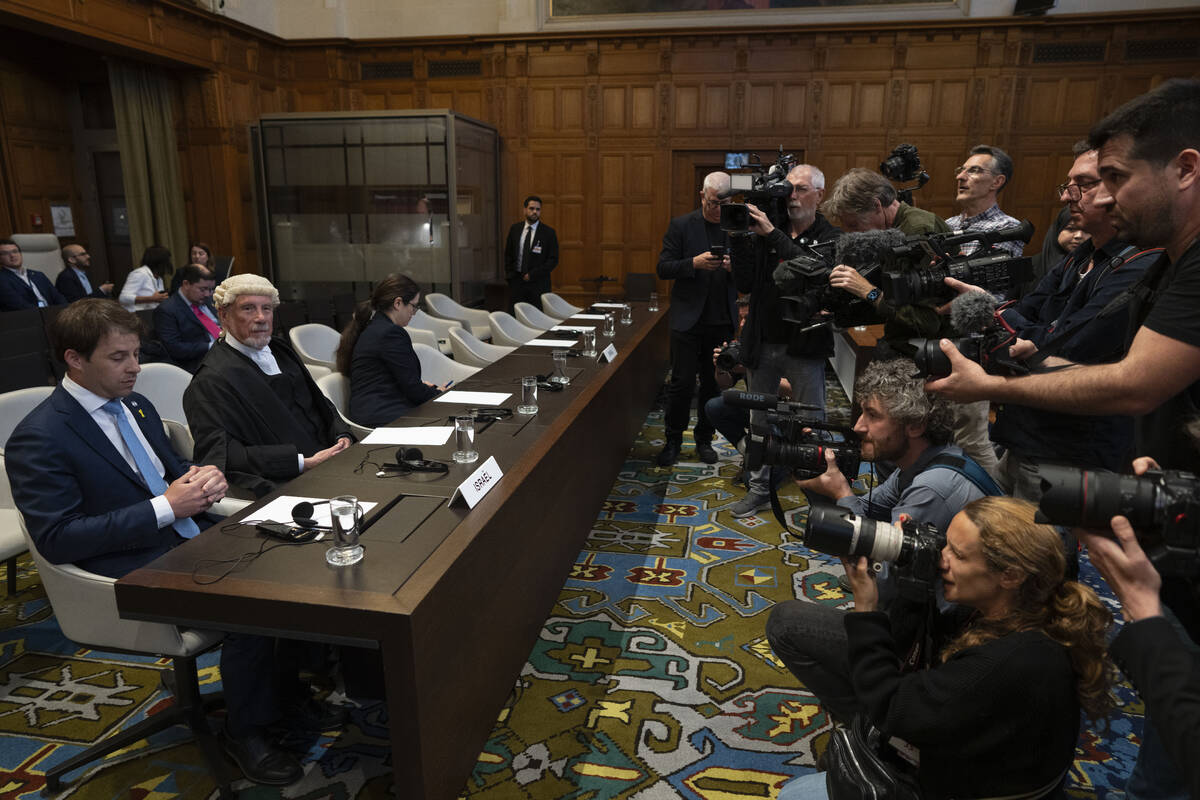 Journalists take images of Israel legal team before Judges enter the International Court of Jus ...