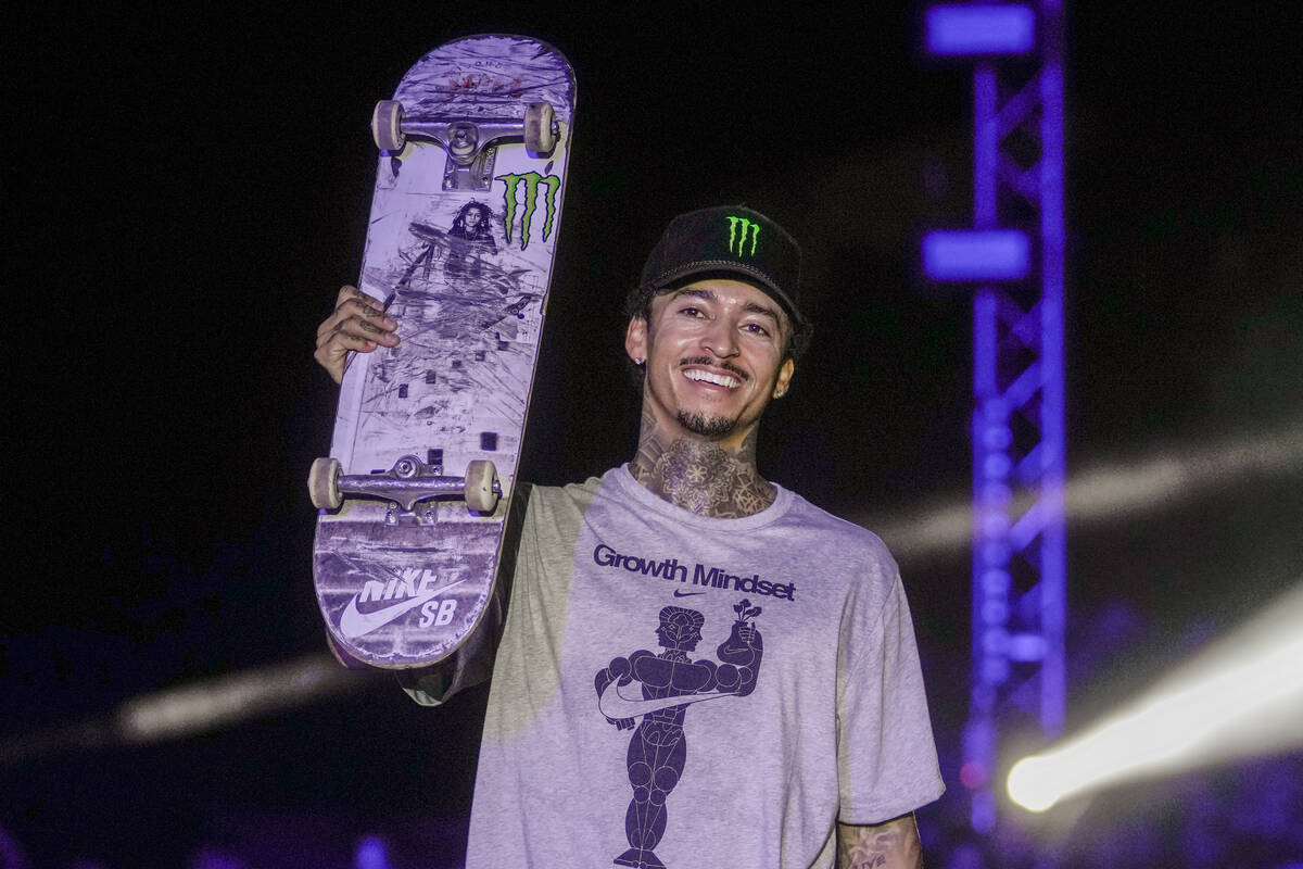 Nyjah Huston of the United States celebrates on the podium after winning the men finals at the ...
