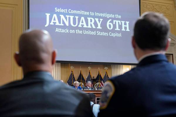 U.S. Capitol Police Sgt. Aquilino Gonell, left, and Washington Metropolitan Police Department o ...