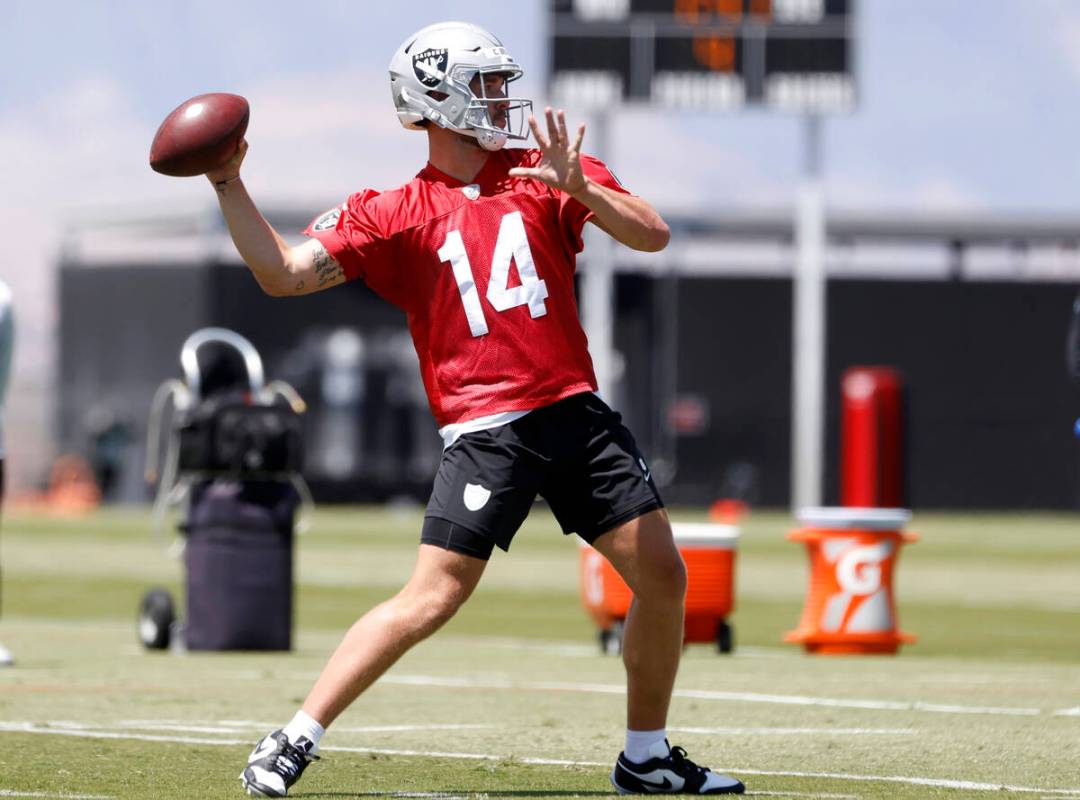 Raiders rookie quarterback Carter Bradley (14) throws the ball during rookies first day of prac ...