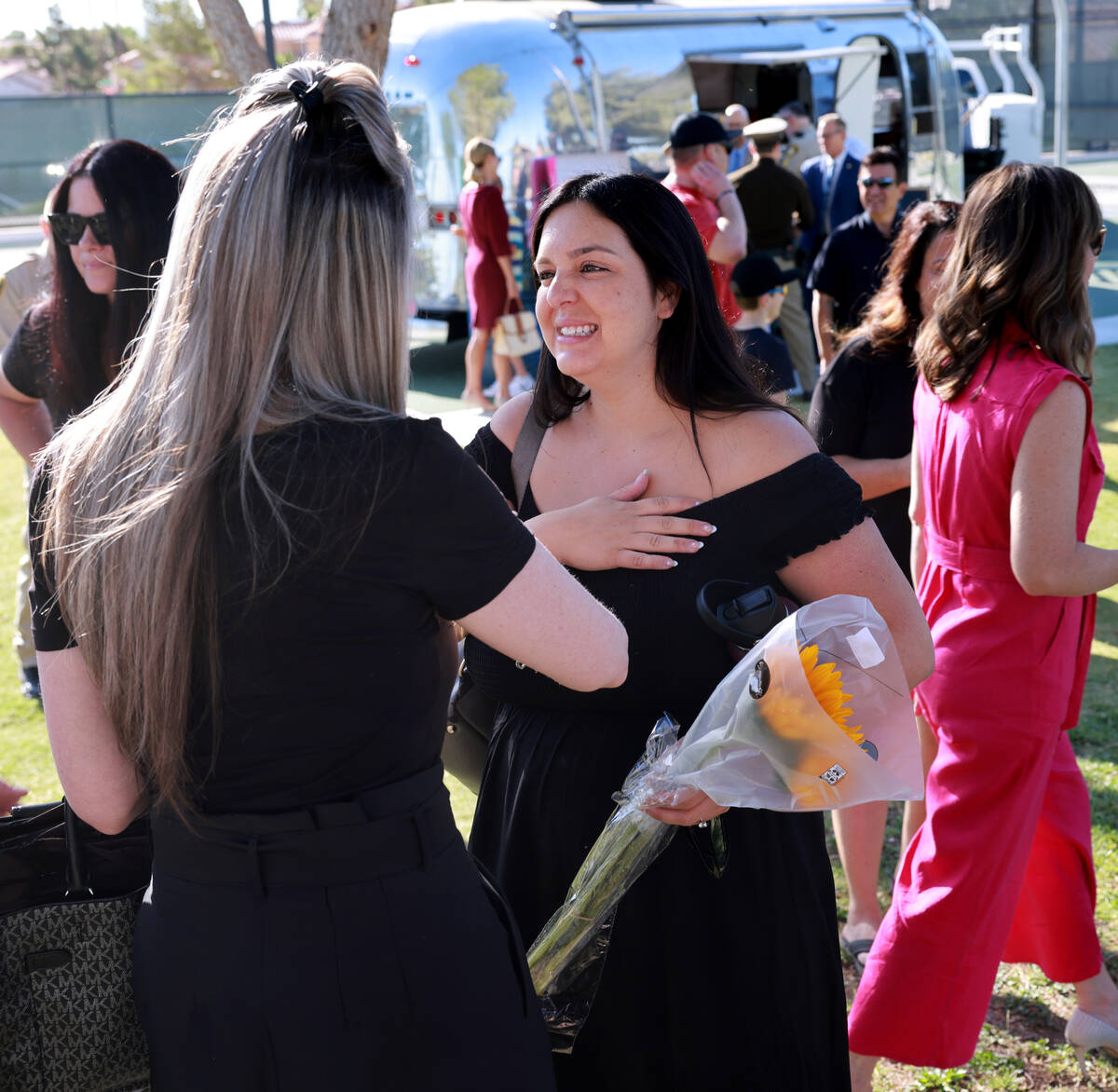 Kylee Prendes, daughter of fallen Las Vegas police Sgt. Henry Prendes, right, greets family fri ...