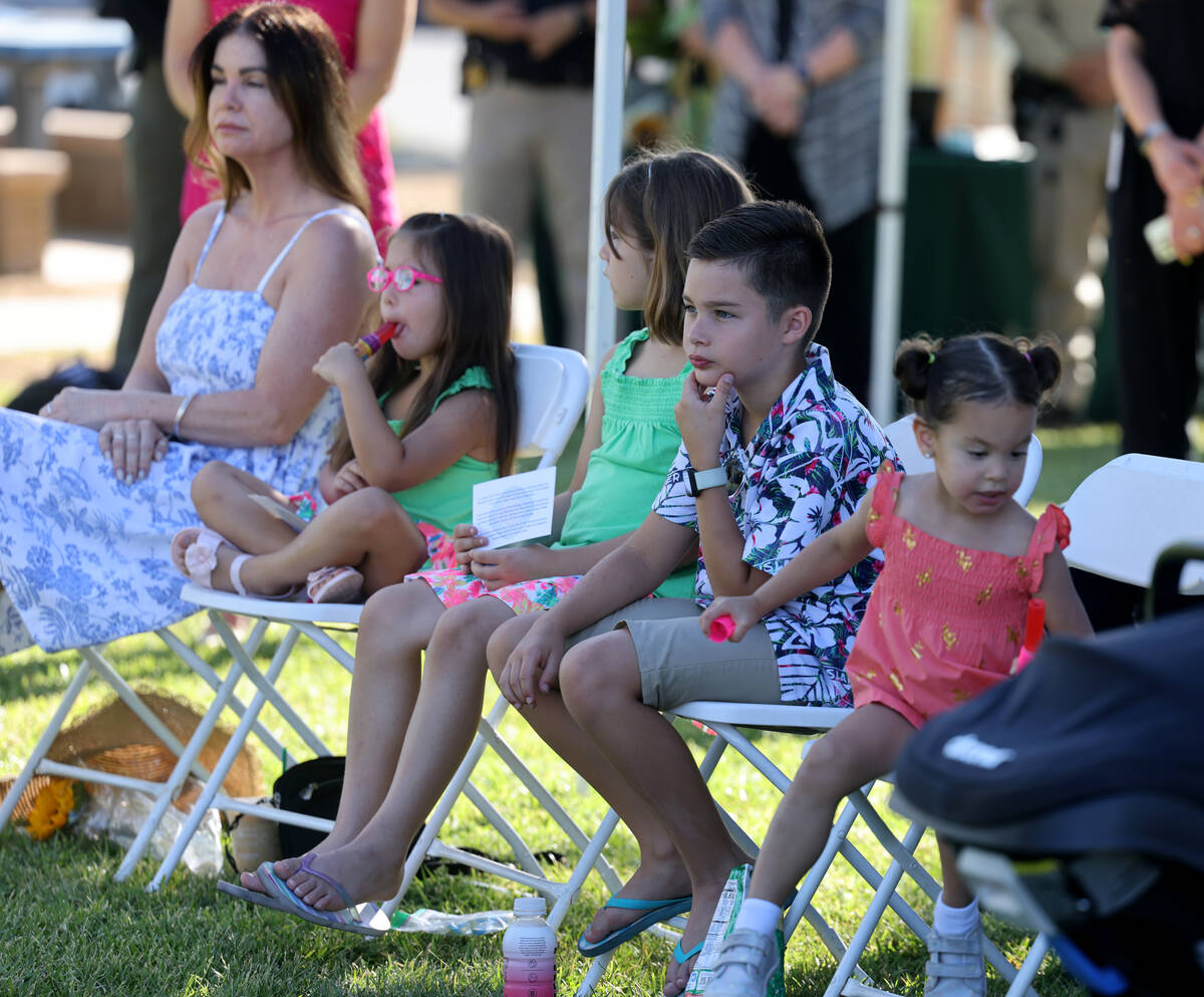 Grandchildren of fallen Las Vegas police Sgt. Henry Prendes, from left, Blake, 4, Brielle, 8, G ...