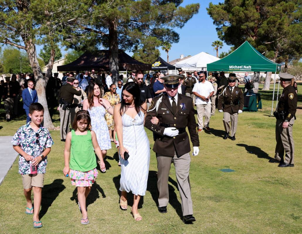 Brooke Prendes, daughter of fallen Las Vegas police Sgt. Henry Prendes, walks with two of her c ...