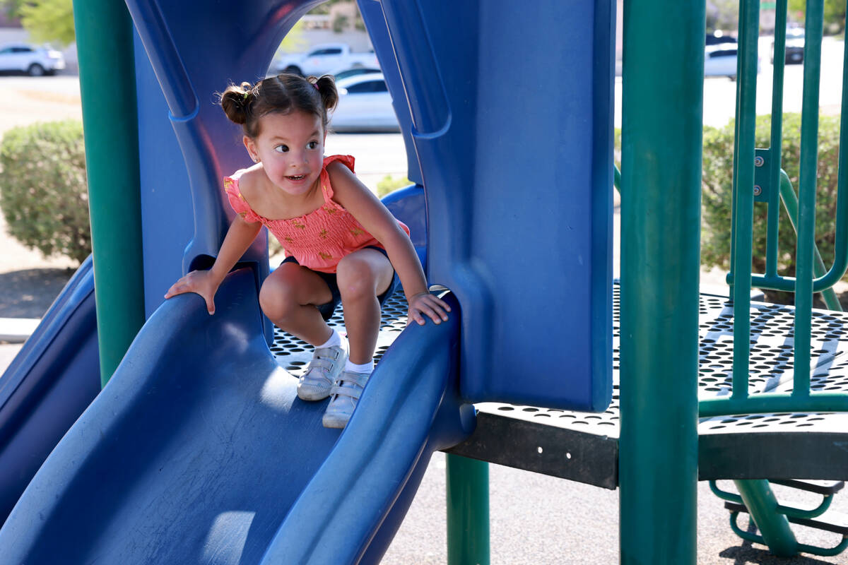 Selena, 2, granddaughter of fallen Las Vegas police Sgt. Henry Prendes, plays in the newly rena ...