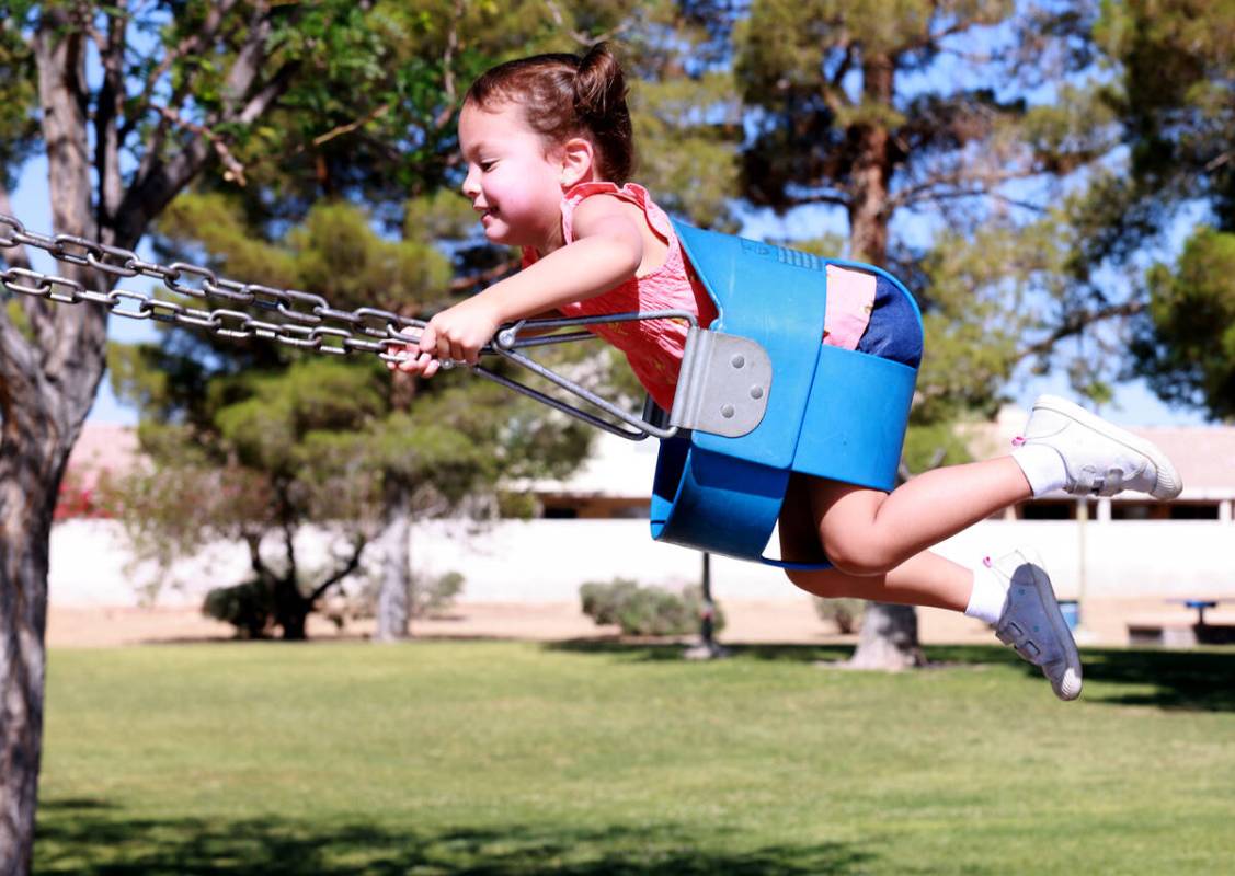 Selena, 2, granddaughter of fallen Las Vegas police Sgt. Henry Prendes, plays in the newly rena ...