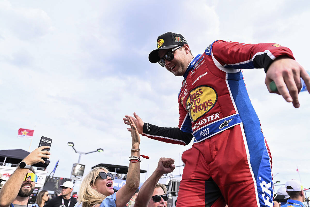 Driver Noah Gragson high-fives fans prior to a NASCAR Cup Series auto race at Charlotte Motor S ...