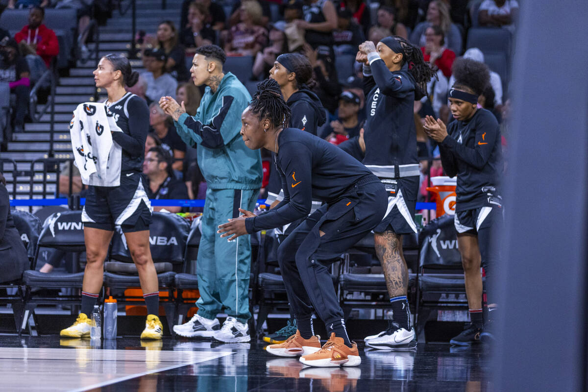 Aces guard Chelsea Gray (12) and teammates watch the action down court against the Phoenix Merc ...