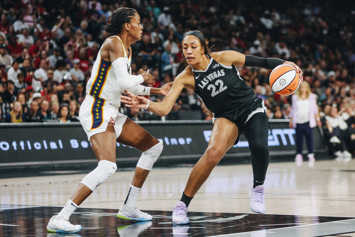 Aces center A'ja Wilson (22) keeps the ball in her possession during a game between the Aces an ...