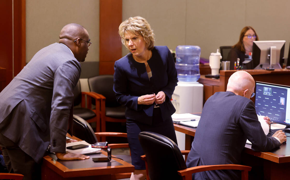Tammy Peterson confers with fellow Meta attorney David Sneed during a Clark County District Cou ...