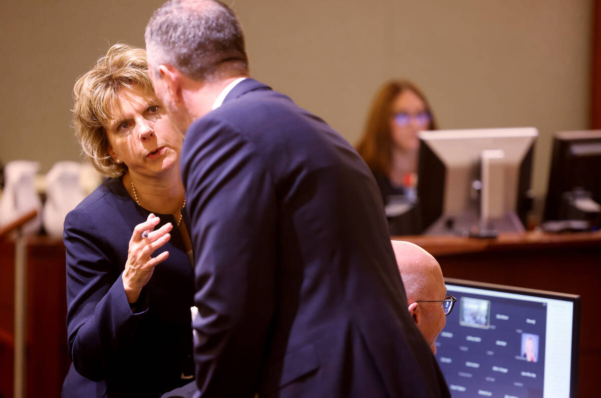 Meta attorney Tammy Peterson confers State of Nevada attorney Michael Gayan during a Clark Coun ...