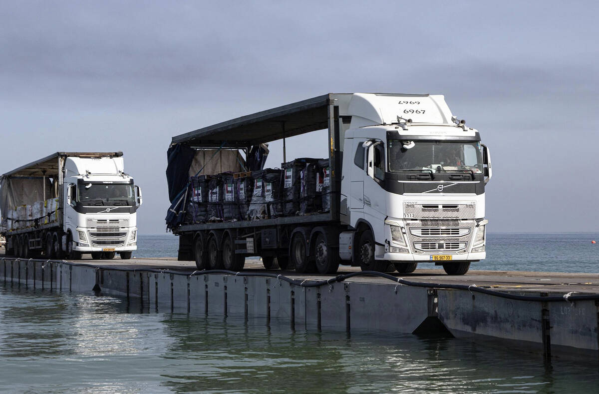 FILE - This image provided by the U.S. Army shows trucks loaded with humanitarian aid from the ...