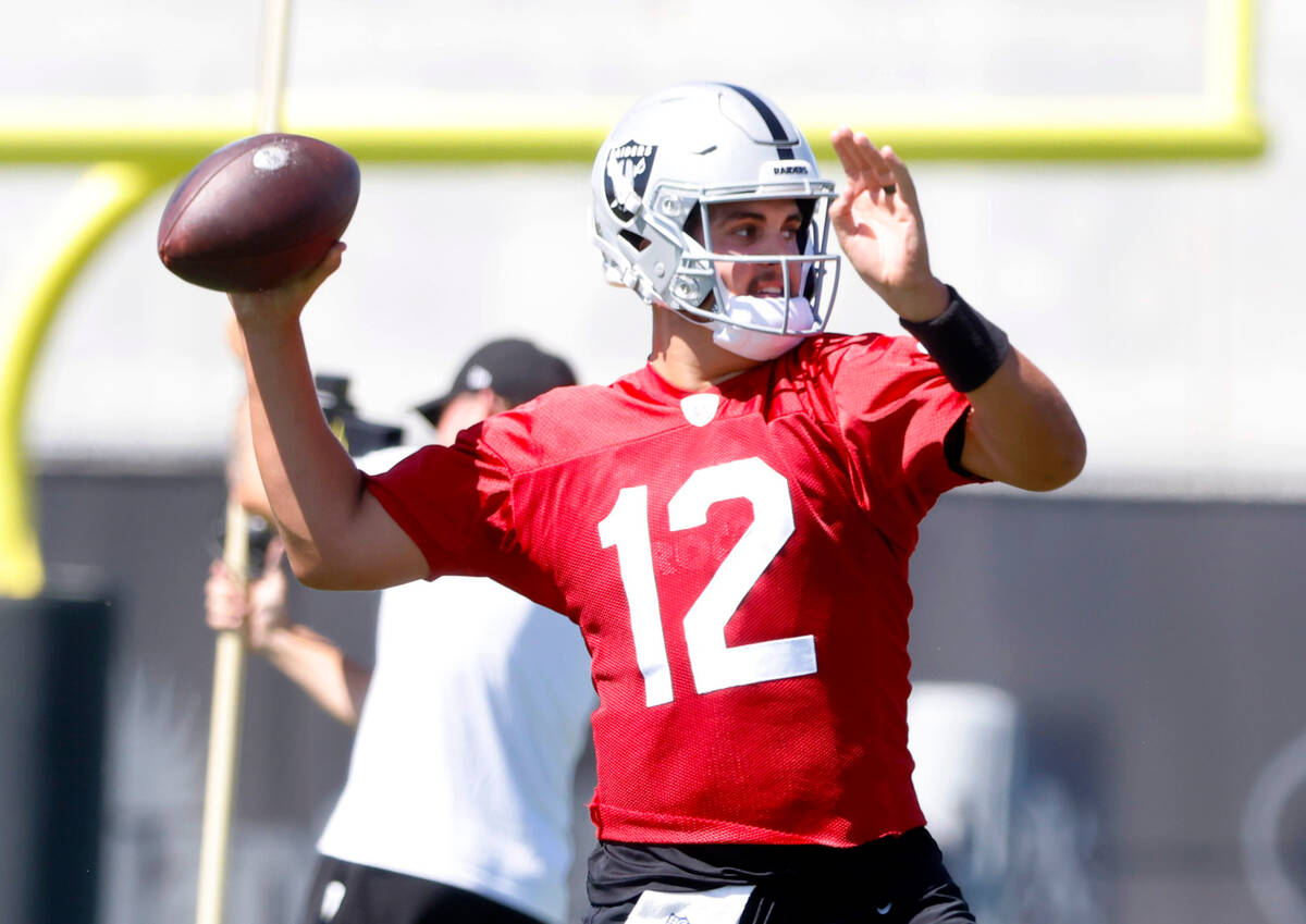 Raiders quarterback Aiden O'Connell (12) prepares to throw the ball during team's practice at t ...