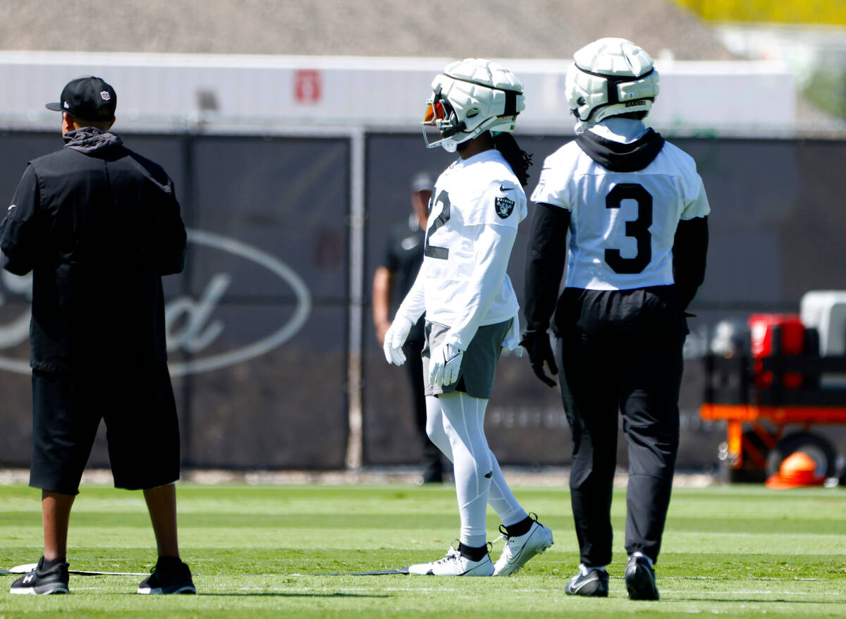 Raiders running backs Alexander Mattison (22) and Zamir White (3) take the field to participate ...