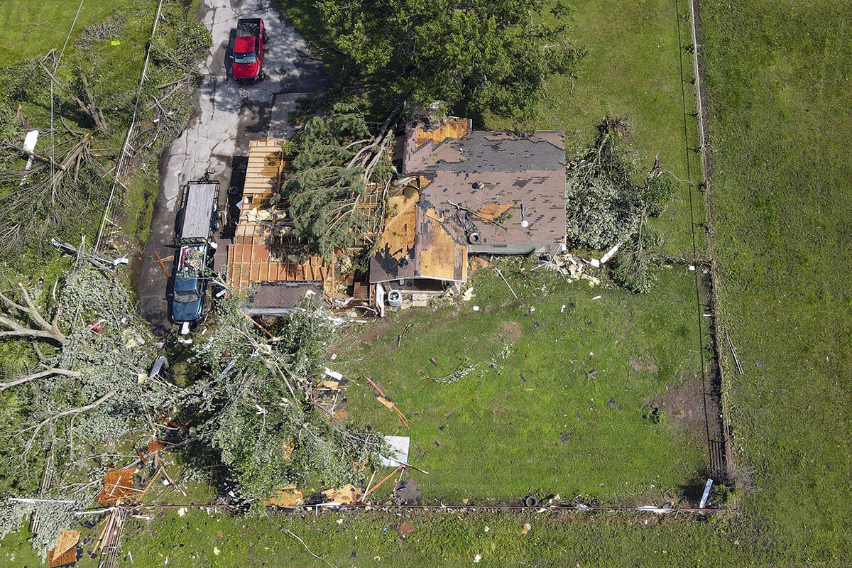 A home damaged by a storm the night before is seen, Sunday, May 26, 2024, in Pryor, Okla. Power ...
