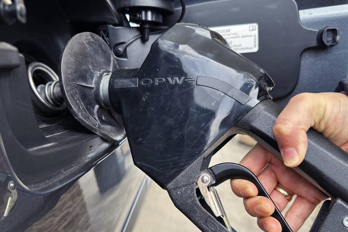 A customer pumps gas at a gas station in this February 2024 file photo. (AP Photo/Nam Y. Huh, file)