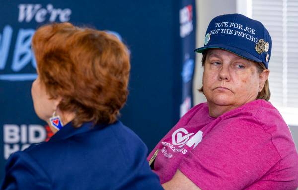 Mary Dungan wears her unique hat as friend Donna West sports Nevada earrings during a press con ...