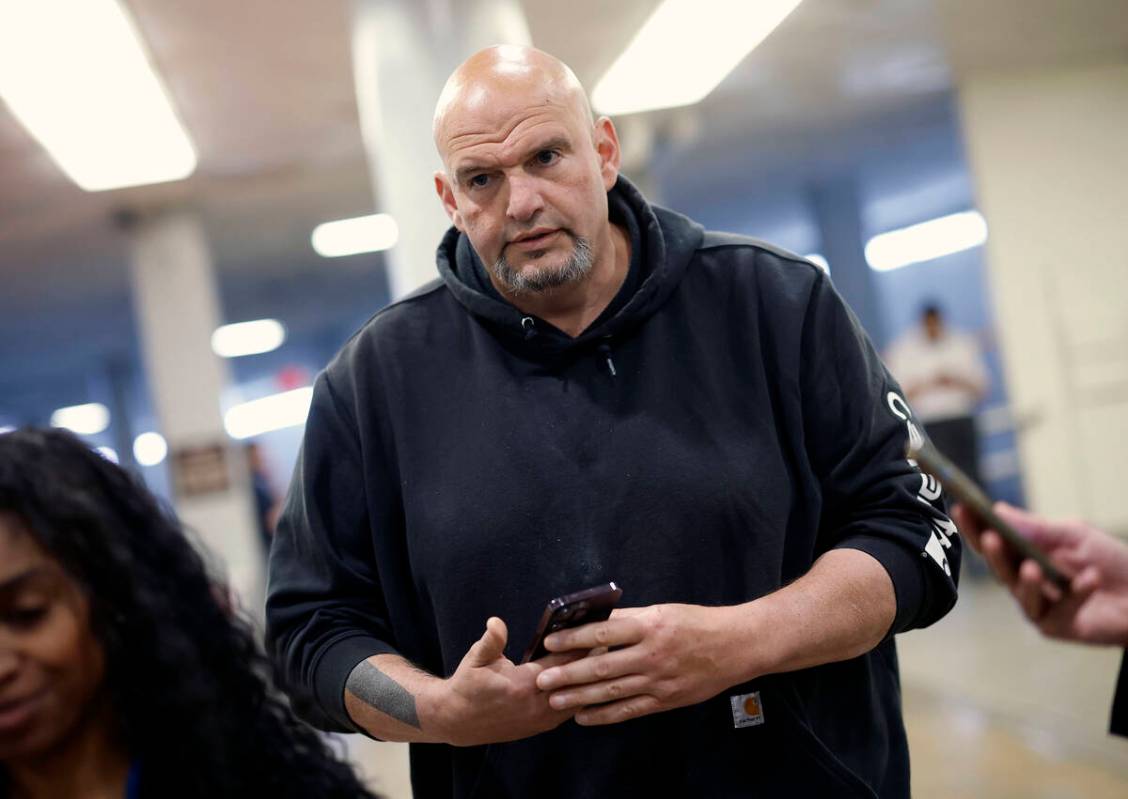 Sen. John Fetterman (D-PA) walks to the Senate chamber at the U.S. Capitol on April 23, 2024, i ...