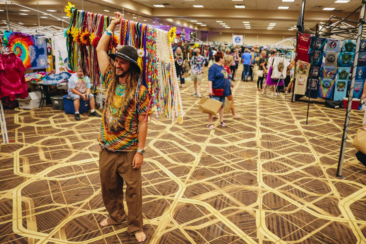 Shayne Dunn sells floral headbands at Shakedown Street at the Tuscany Suites on Thursday, May 3 ...