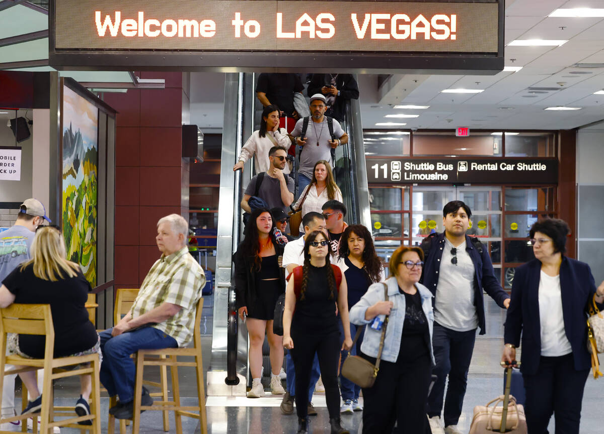 Passengers arrive at Terminal-1 of Harry Reid International Airport on Friday, May 24, 2024, in ...