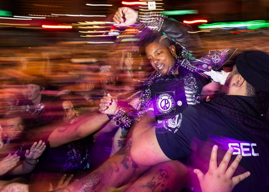 A festival attendee crowd surfs as The Chats perform during the Punk Rock Bowling music festiva ...