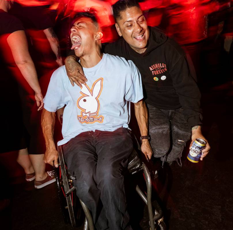 A festival attendee in a wheelchair moshes as The Meteors perform during a Punk Rock Bowling mu ...