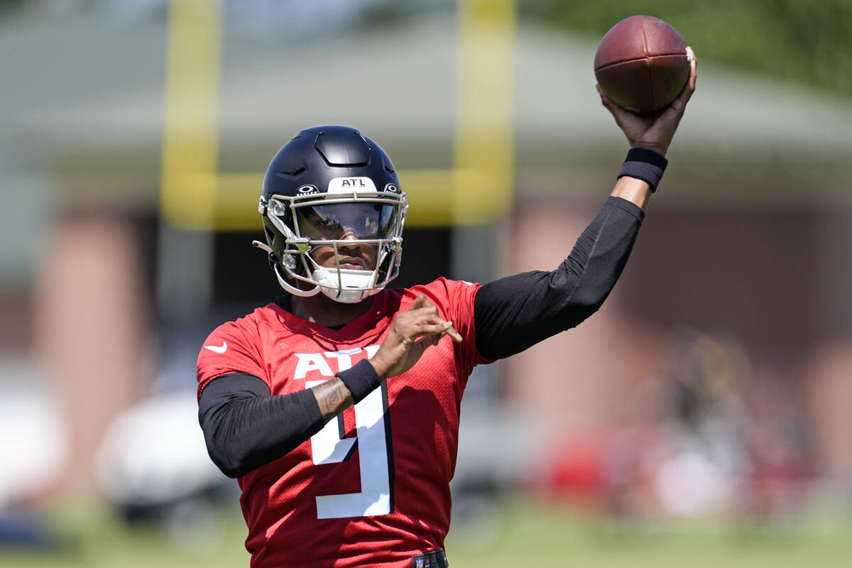 Atlanta Falcons first round draft pick quarterback Michael Penix Jr., runs a passing drill duri ...