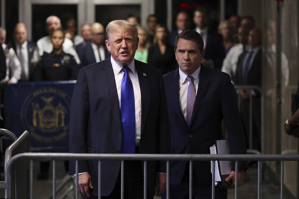 Former President Donald Trump speaks to the media alongside his attorney Todd Blanche after the ...