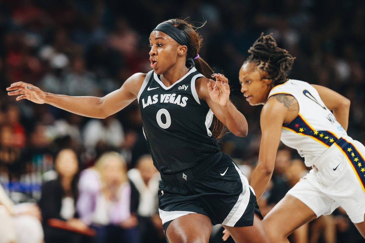 Aces guard Jackie Young (0) races to the other side of the court during a game between the Aces ...