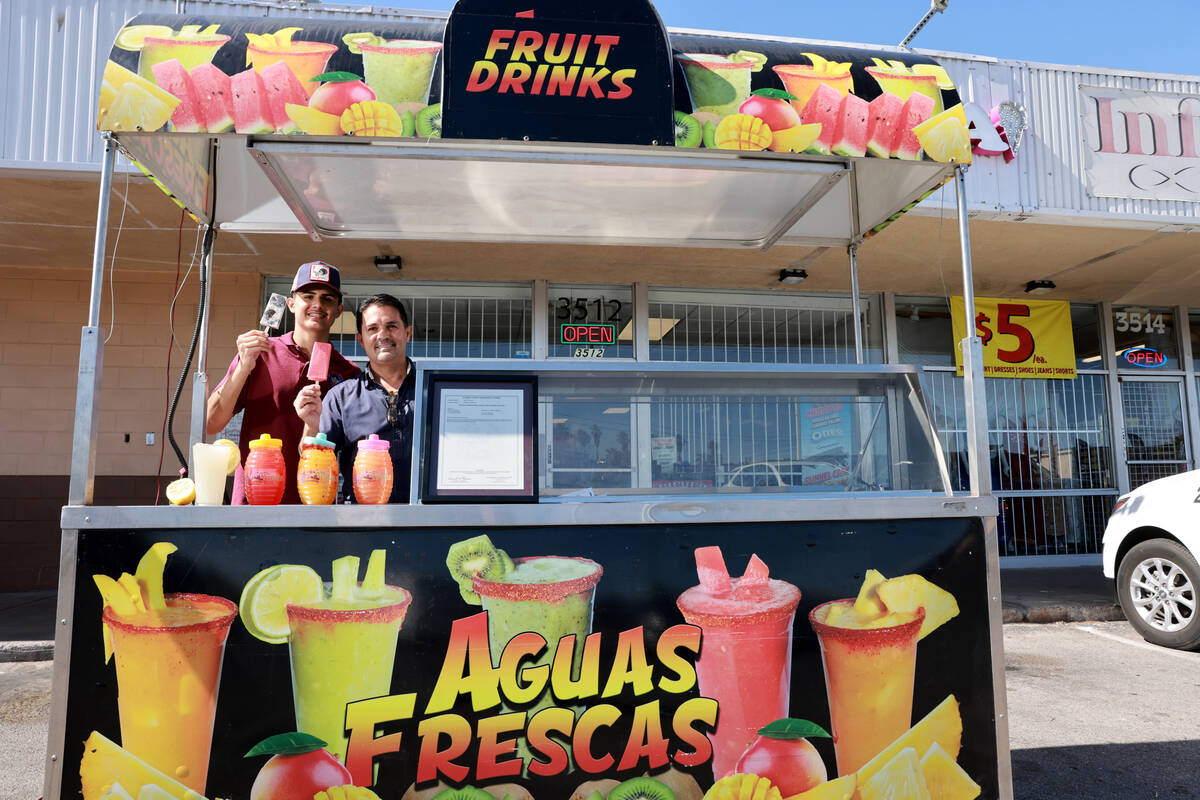 Alan Carrera, 16, and his father José Manuel Carrera show some of their products and the first ...