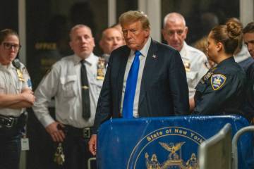 Former President Donald Trump walks outside of Manhattan Criminal Court after a jury convicted ...