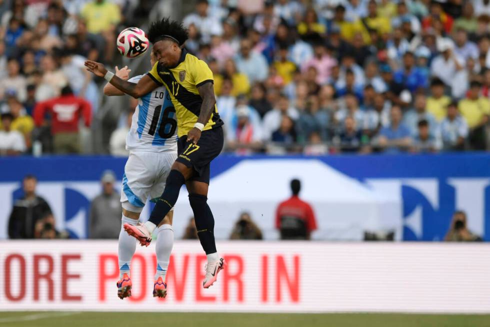 Argentina's Giovani Lo Celso (16) battles Ecuador's Angelo Preciado (17) for a header during th ...