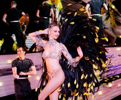 RJ FILE*** CRAIG L. MORAN/REVIEW-JOURNAL A showgirl struts across the stage during a performa ...