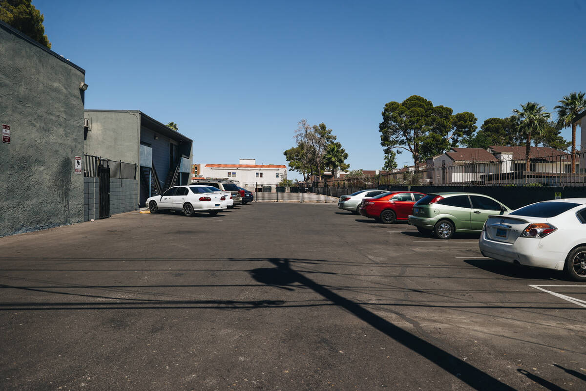 An apartment complex parking lot where a car was found and a gun was found on the roof after a ...