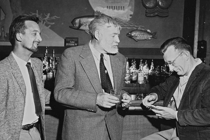 Ernest Hemingway, center, talks with Las Vegas Review-Journal staff writer Colin McKinlay, righ ...