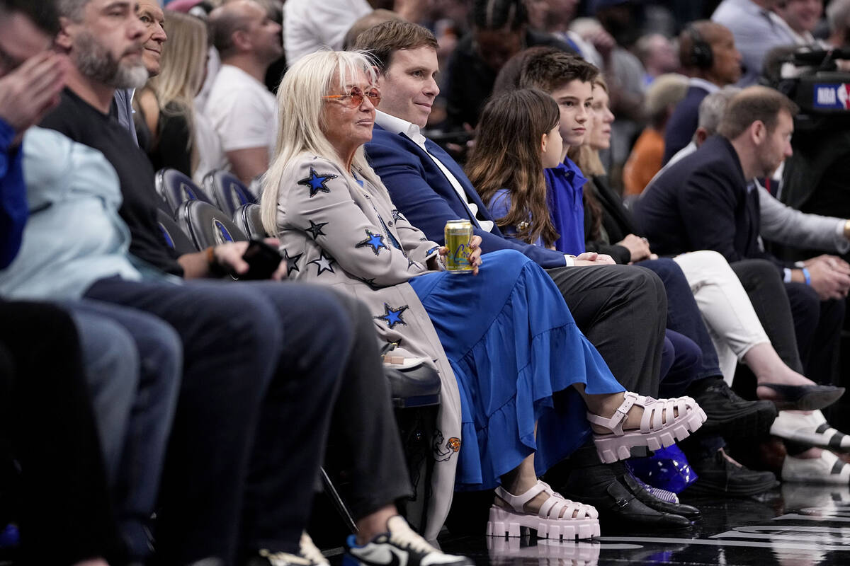 Miriam Adelson, center left, and Dallas Mavericks governor Patrick Dumont, center right, watch ...