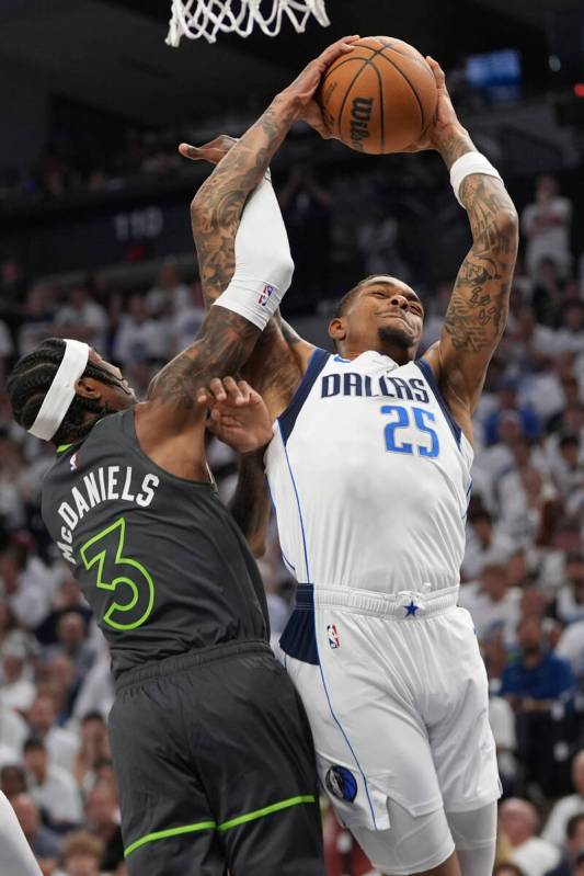 Dallas Mavericks forward P.J. Washington (25) grabs a rebound against Minnesota Timberwolves fo ...