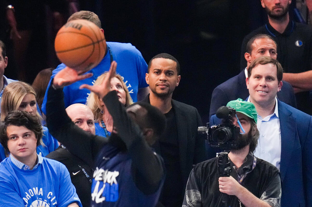 Dallas Mavericks governor Patrick Dumont (right) watches the team warm up before Game 2 of an N ...