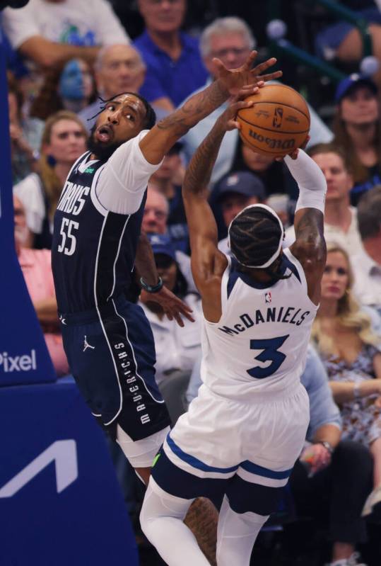 Minnesota Timberwolves forward Jaden McDaniels (3) shoots against Dallas Mavericks forward Derr ...